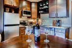 Fully equipped kitchen with stainless steel appliances.